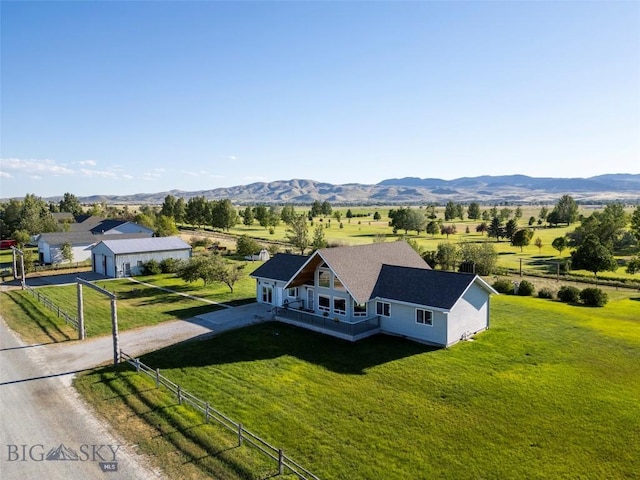 drone / aerial view featuring a mountain view and a rural view