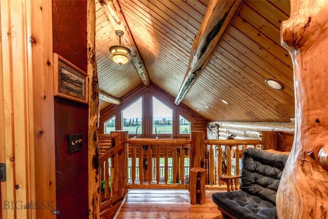 interior space featuring lofted ceiling with beams, wood ceiling, and hardwood / wood-style floors