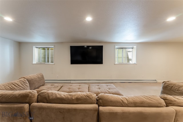 living room with a baseboard heating unit and a textured ceiling