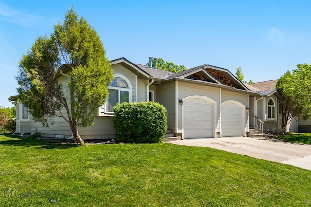 ranch-style home with a garage and a front lawn