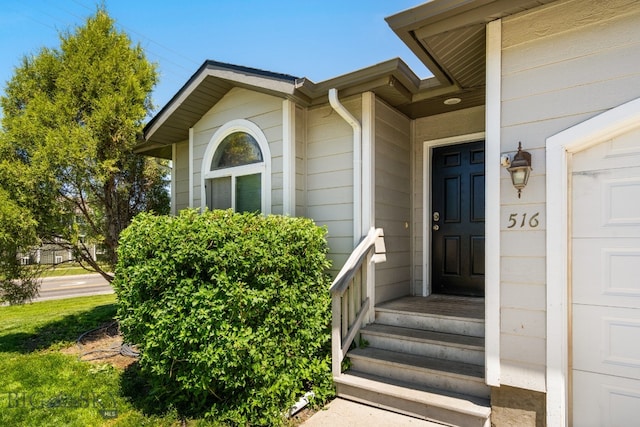 doorway to property featuring a garage