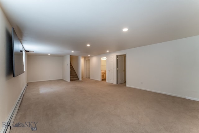 interior space with a baseboard radiator and carpet flooring