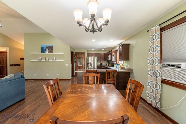 dining area featuring cooling unit, dark wood-type flooring, and a notable chandelier