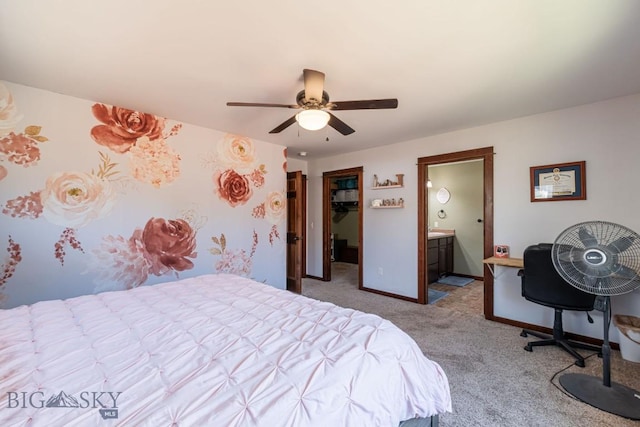 carpeted bedroom with ceiling fan and ensuite bathroom