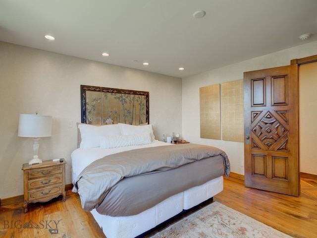 bedroom featuring wood-type flooring