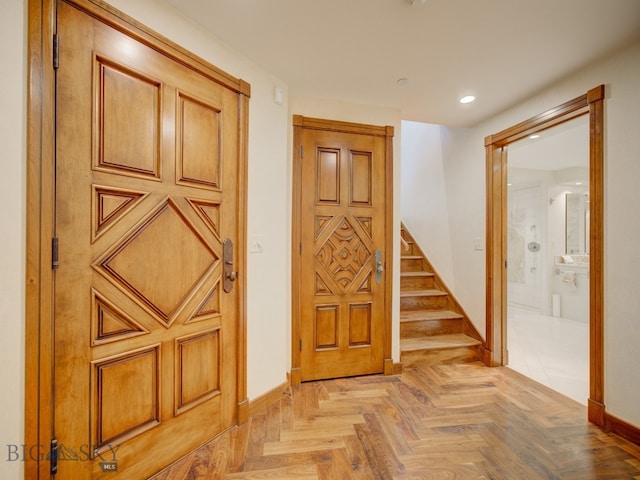 foyer entrance featuring light parquet floors