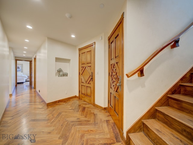 hallway featuring light parquet flooring