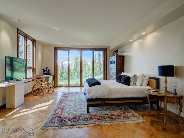 bedroom featuring light parquet flooring and access to exterior