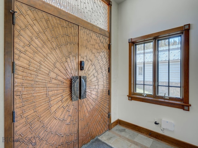 interior space featuring tile patterned flooring and plenty of natural light