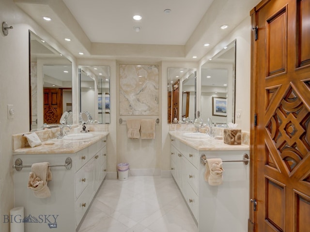 bathroom featuring tile patterned flooring and vanity