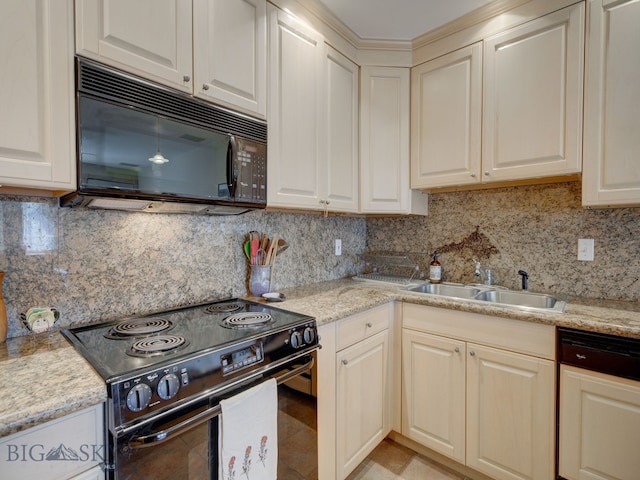 kitchen featuring sink, light stone countertops, black appliances, and backsplash