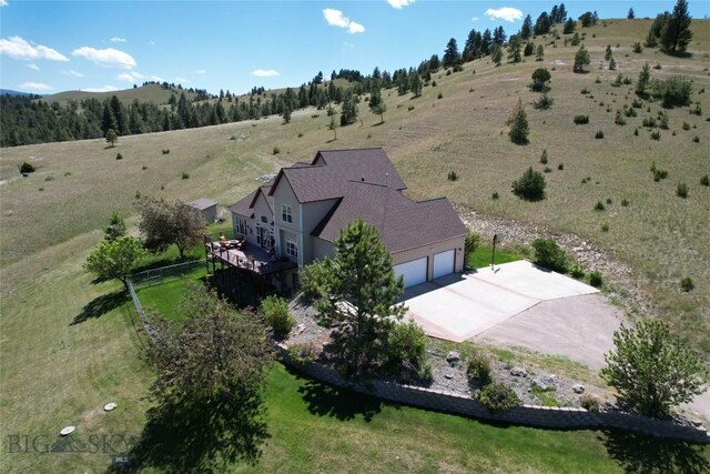 birds eye view of property with a rural view