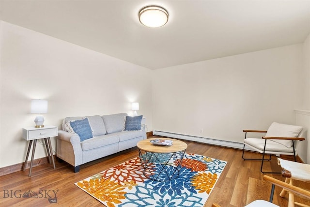 living room with hardwood / wood-style flooring and a baseboard radiator