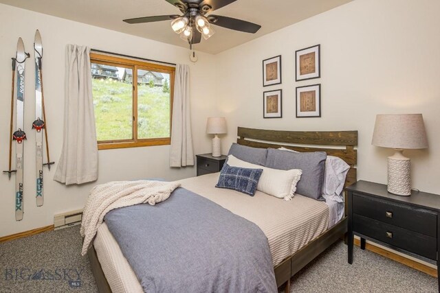 bedroom with carpet, baseboard heating, and ceiling fan