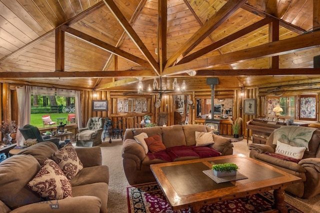 carpeted living room featuring wood walls, beamed ceiling, and wooden ceiling