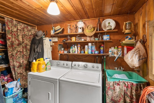 laundry room featuring wood walls, sink, washer and dryer, and wooden ceiling