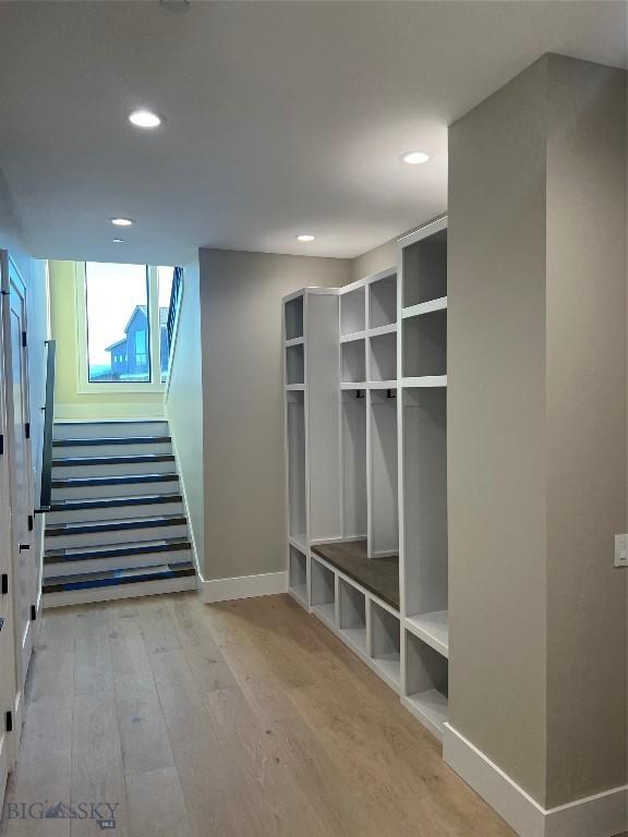 mudroom with light hardwood / wood-style flooring