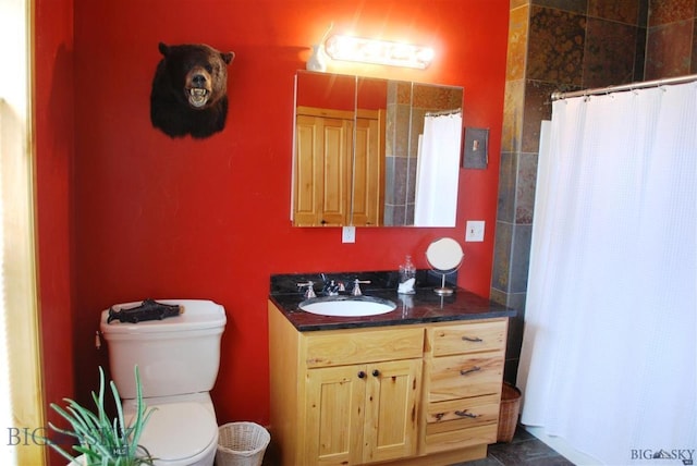 bathroom featuring vanity and toilet