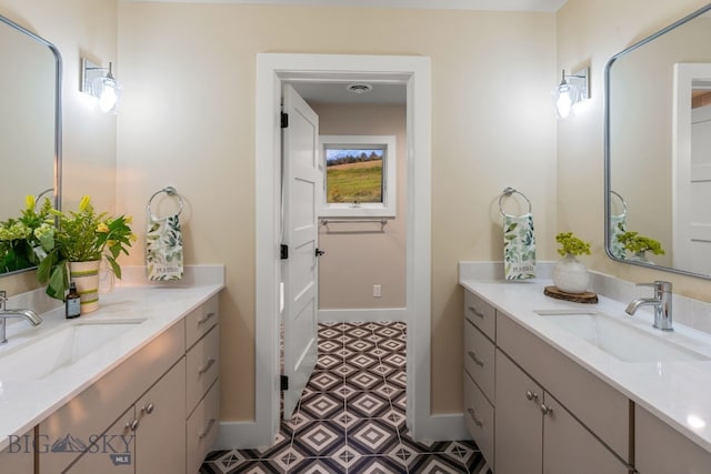 bathroom with vanity and tile patterned flooring