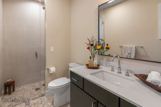 bathroom with vanity, an enclosed shower, tile patterned flooring, and toilet