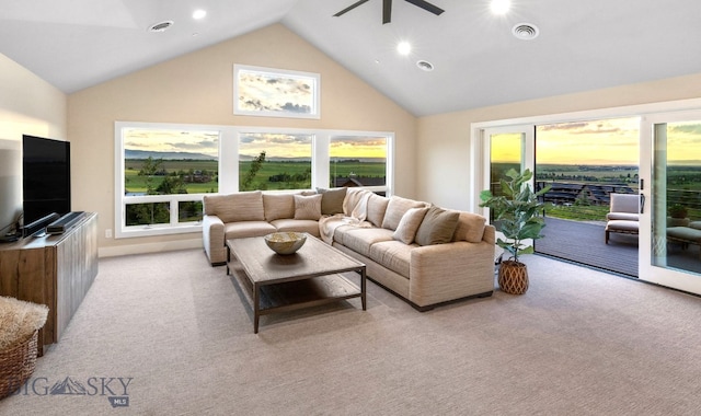 living room featuring light colored carpet and high vaulted ceiling