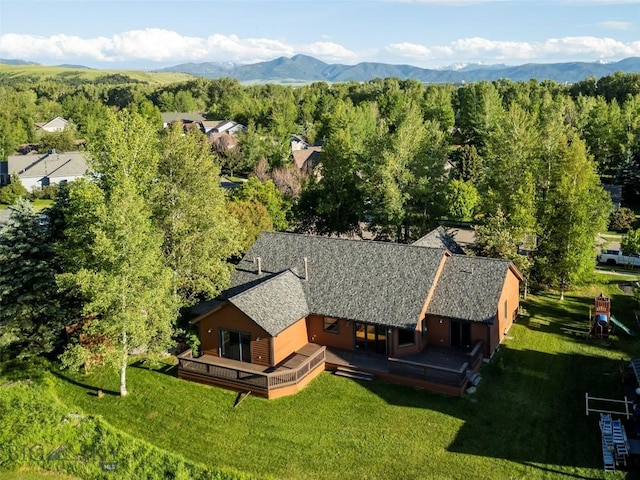 aerial view with a mountain view and a wooded view