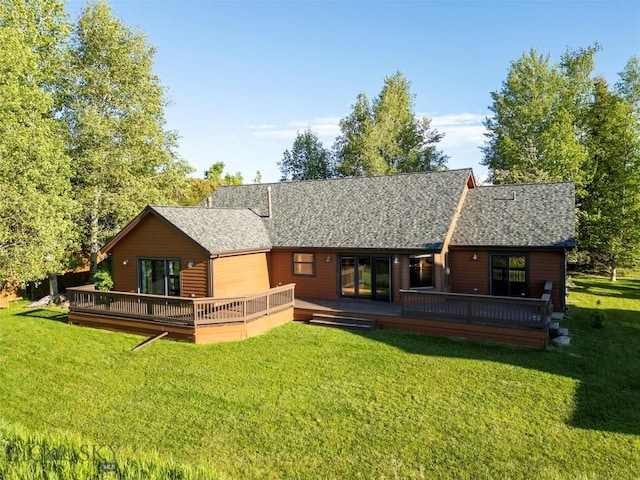 3127 Augusta Dr, Bozeman, MT 59715 - rear view of property featuring a lawn, roof with shingles, and a wooden deck