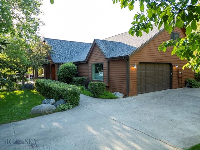 3127 Augusta Dr, Bozeman, MT 59715 - view of front of home featuring an attached garage, roof with shingles, driveway, and a front lawn