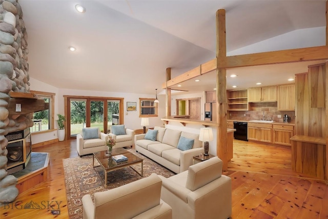 3127 Augusta Dr, Bozeman, MT 59715 - living room with light wood-style flooring, recessed lighting, a stone fireplace, and high vaulted ceiling