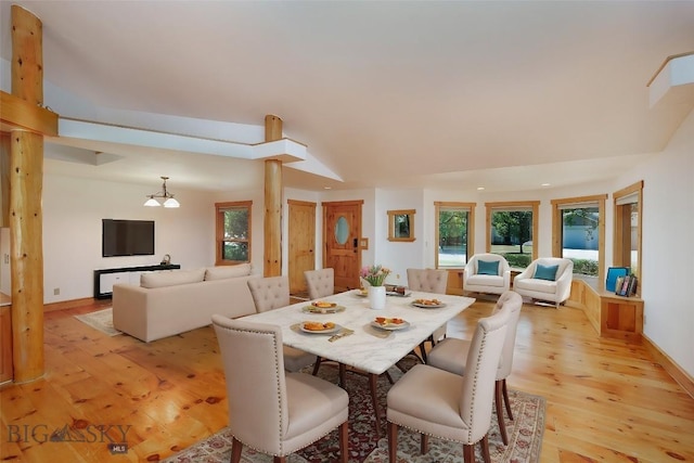 3127 Augusta Dr, Bozeman, MT 59715 - dining area featuring light wood finished floors, a chandelier, and baseboards