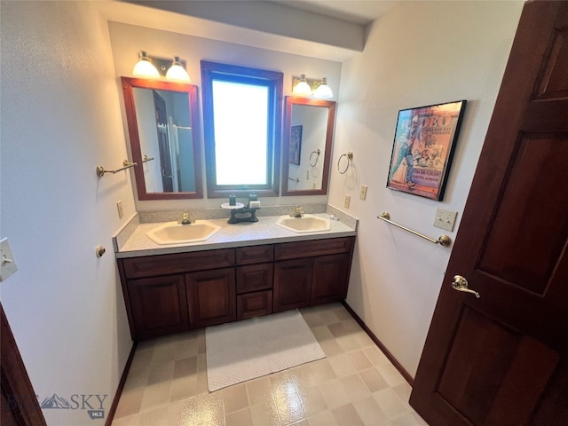 bathroom featuring tile patterned flooring and double sink vanity