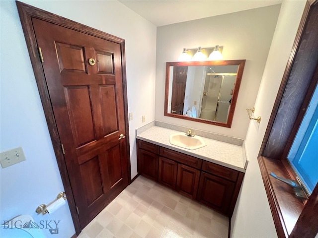 bathroom with tile patterned flooring and vanity