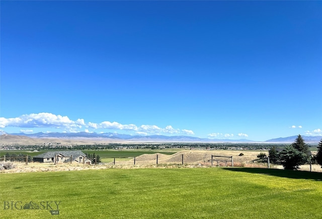 view of mountain feature with a rural view