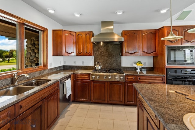 kitchen featuring wall chimney range hood, stainless steel appliances, decorative backsplash, decorative light fixtures, and sink