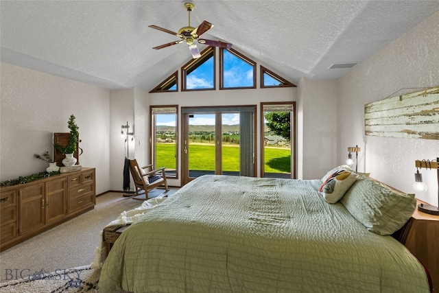 bedroom with a textured ceiling, light colored carpet, high vaulted ceiling, and ceiling fan