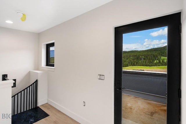 entryway with light hardwood / wood-style floors