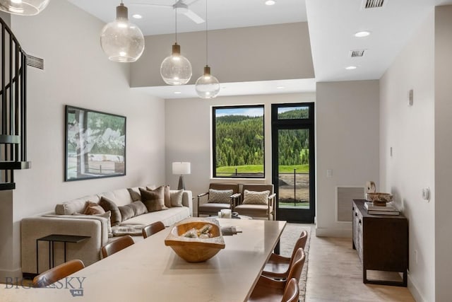 dining space with light hardwood / wood-style flooring