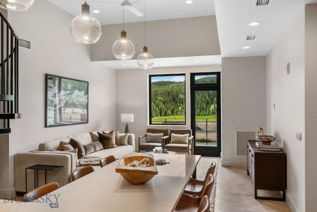 211 Town Center Ave Unit 3G, Big Sky, MT 59716 - dining room with recessed lighting, a towering ceiling, and light wood finished floors