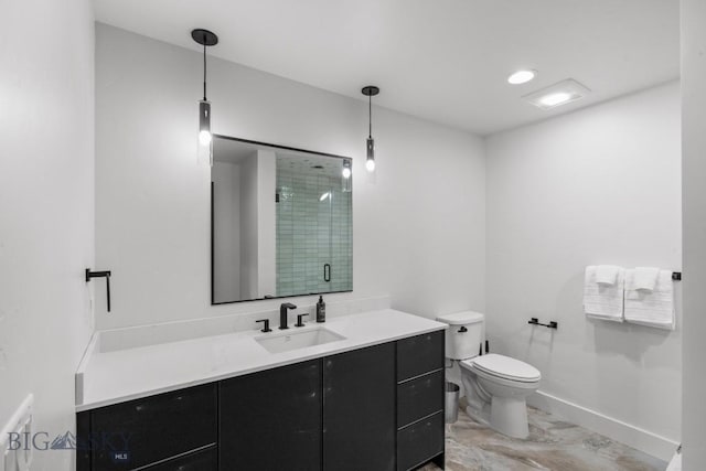 bathroom featuring vanity, toilet, and an enclosed shower