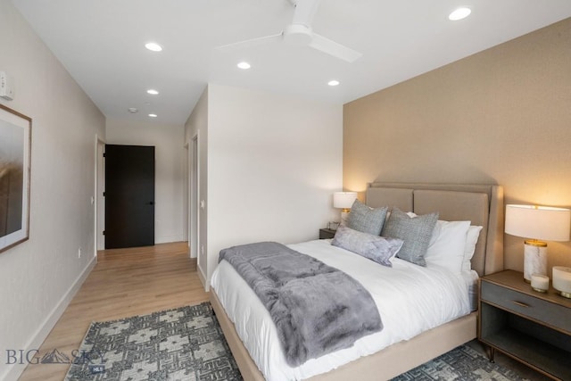 bedroom featuring ceiling fan and light hardwood / wood-style floors