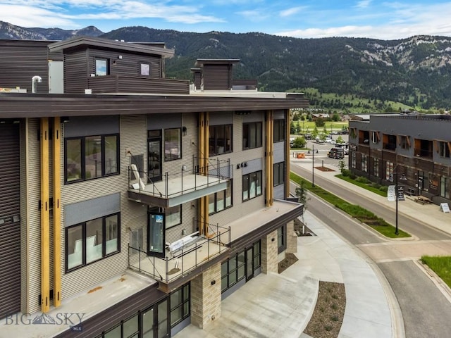 view of building exterior featuring a mountain view