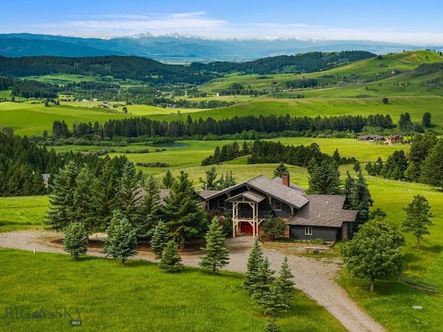 aerial view featuring a rural view and a mountain view