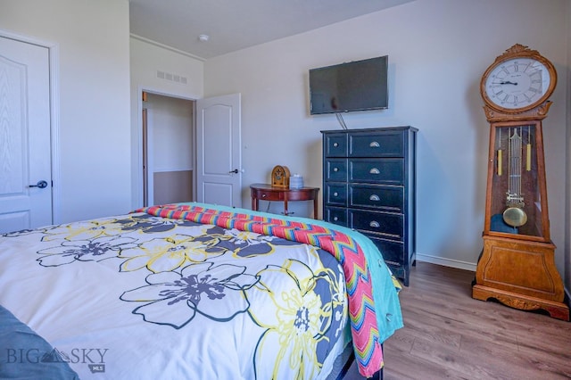 bedroom featuring hardwood / wood-style flooring