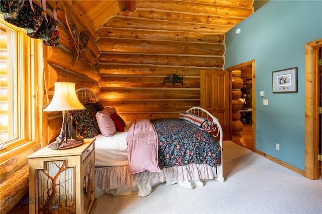 carpeted bedroom with vaulted ceiling, wood ceiling, and rustic walls