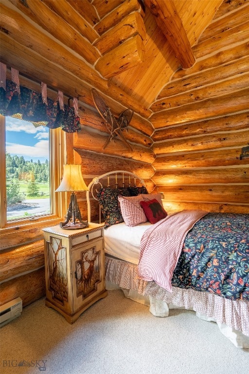 carpeted bedroom featuring a baseboard heating unit, lofted ceiling with beams, log walls, and wood ceiling