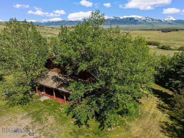 birds eye view of property featuring a mountain view and a rural view