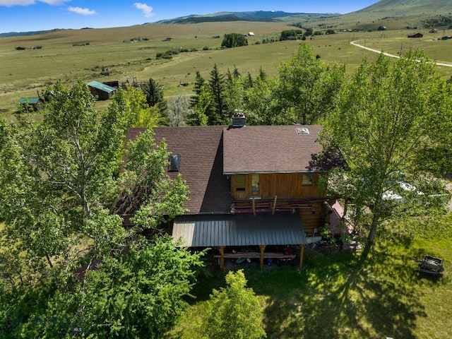 birds eye view of property featuring a mountain view