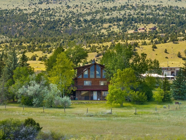 birds eye view of property featuring a rural view