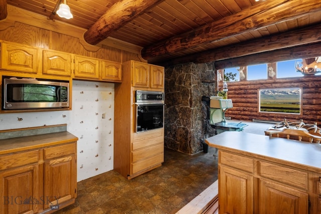 kitchen featuring rustic walls, beamed ceiling, oven, stainless steel microwave, and wood ceiling