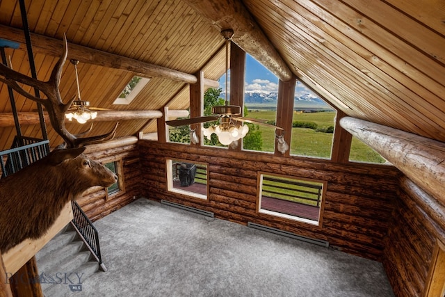 unfurnished living room featuring carpet, vaulted ceiling with beams, wood ceiling, and log walls